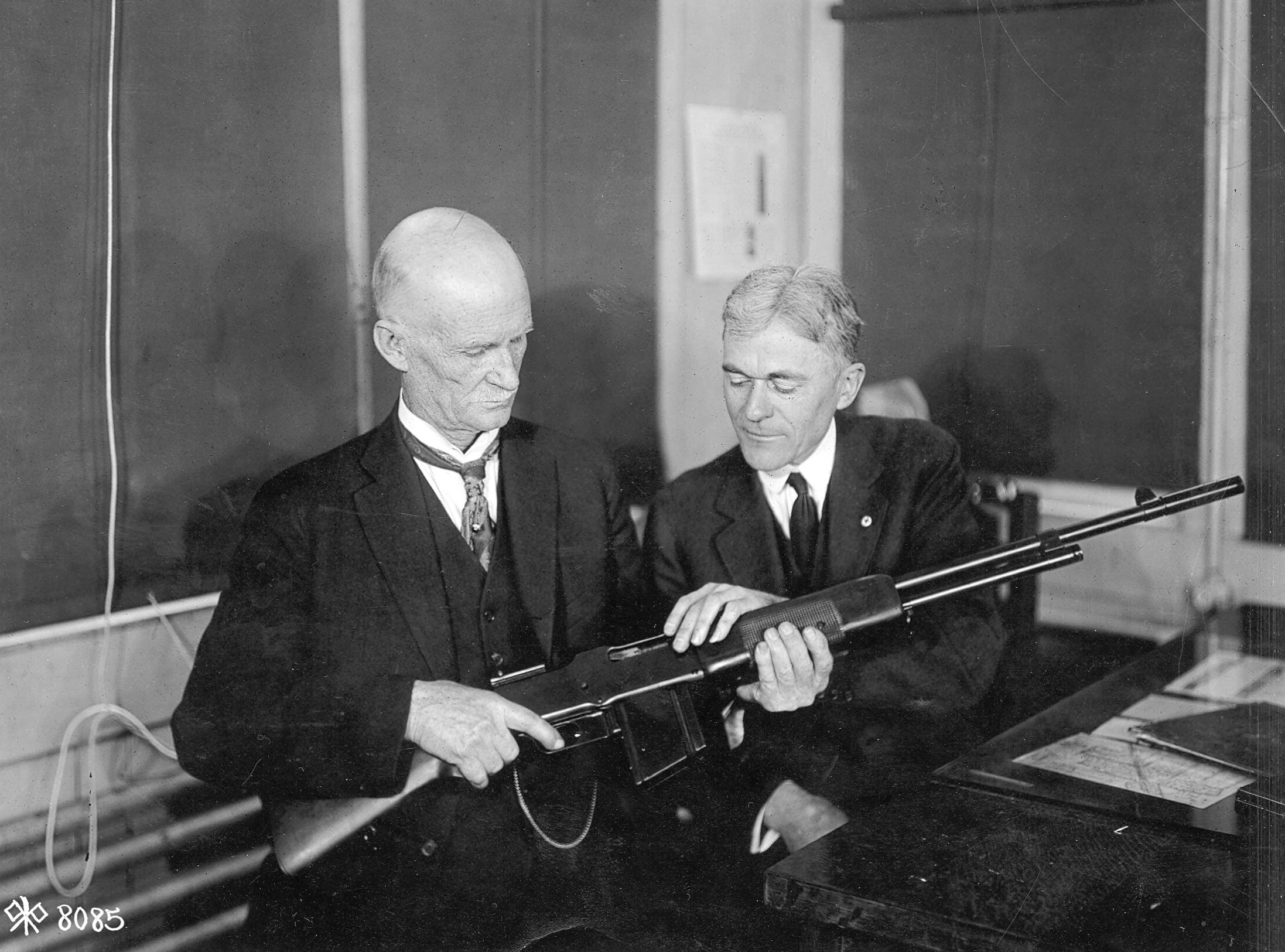 John Moses Browning discussing the Browning Automatic Rifle at the Winchester plant
