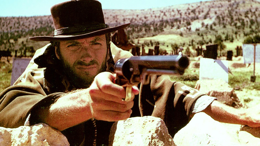 Clint Eastwood aiming a revolver in a western movie.