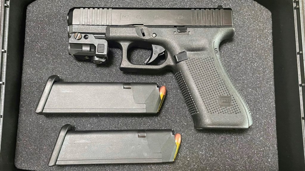 Glock 45 Gen 5 in a gun case with mags full of ammo rounds.