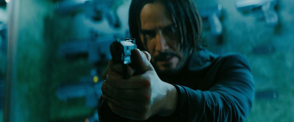 john-wick-aiming-semi-auto-pistol-combat-master-handgun