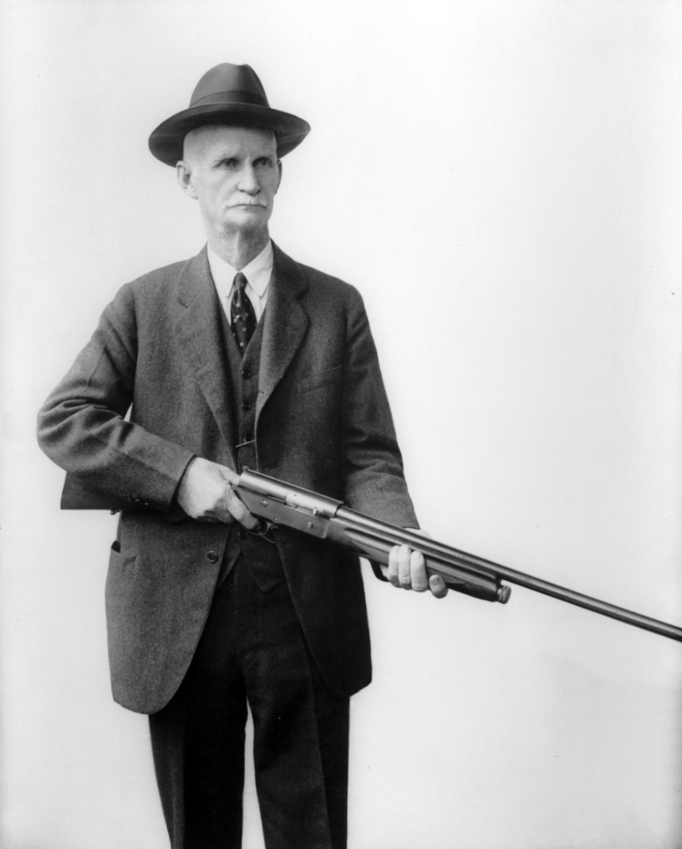 John Moses Browning posing with his Auto-5 shotgun