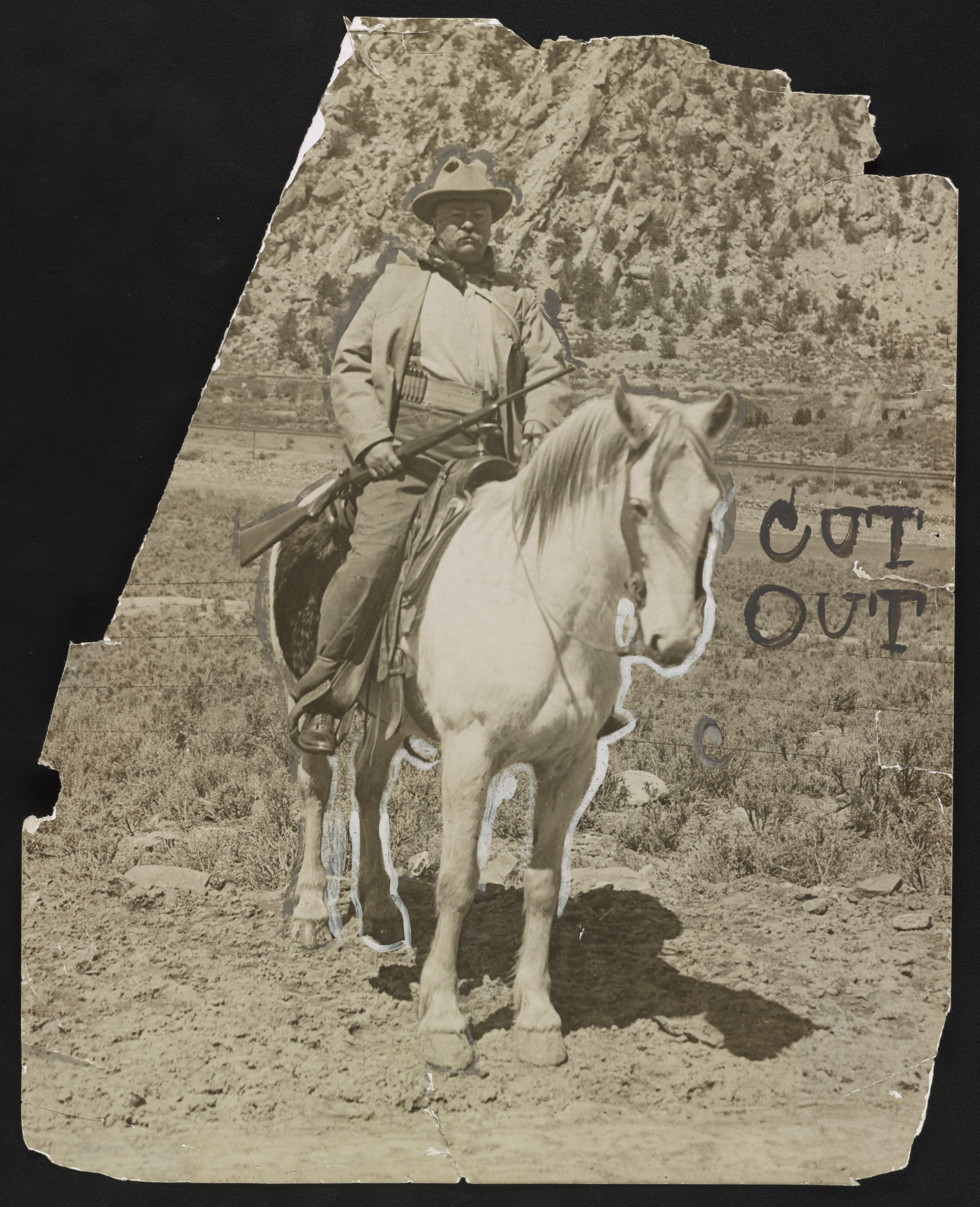 Theodore Roosevelt on horseback holding a rifle