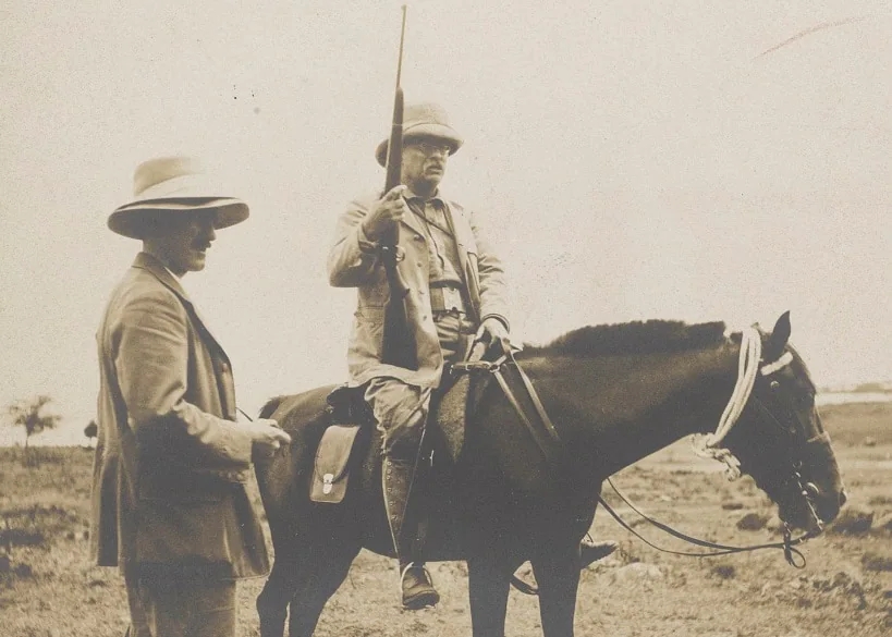 Theodore Roosevelt on horseback with a modified Springfield M1903 rifle