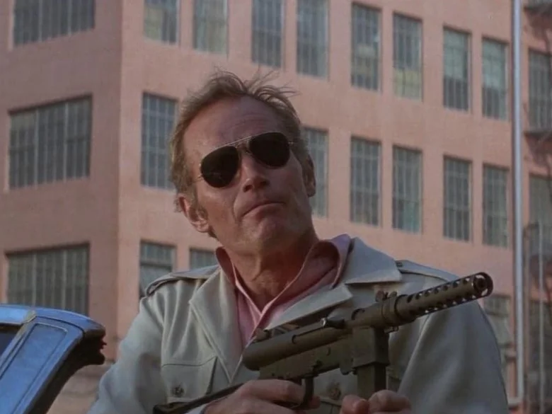 Charlton Heston as Robert Neville holding a Smith & Wesson M76 submachine gun in The Omega Man