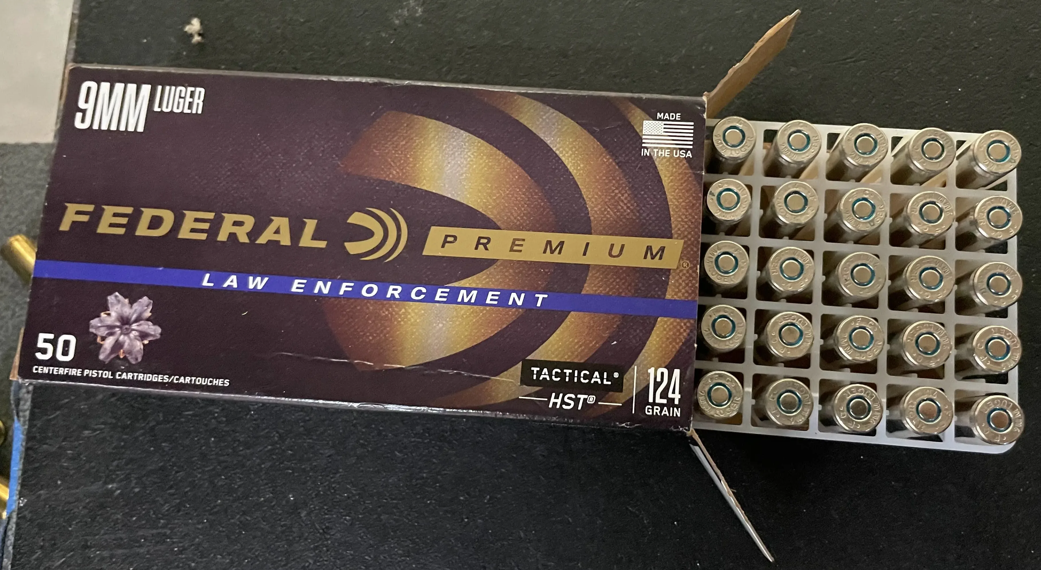 federal premium 9mm luger tactical hst 123 grain ammo 50 center fire pistol cartridges half open showing rounds from overhead