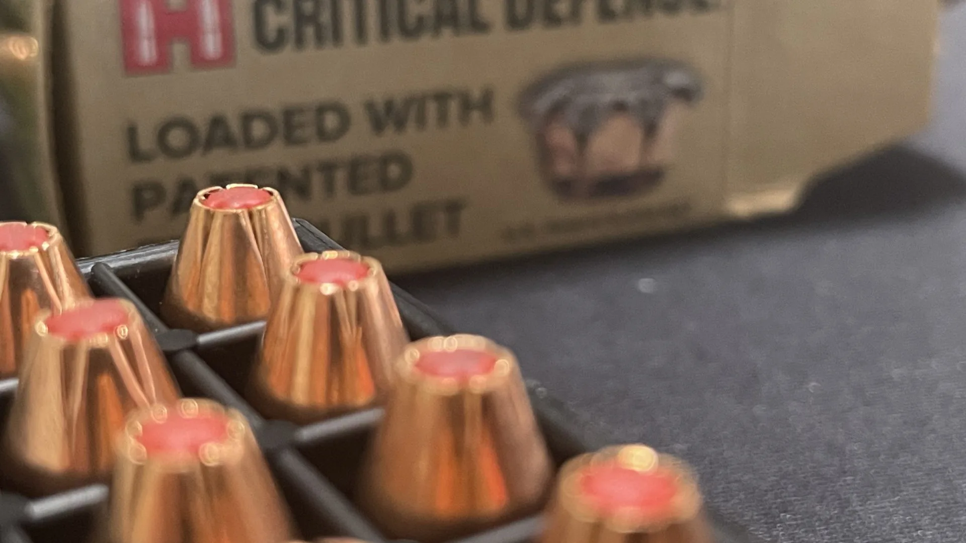 hornady critical defense 9mm ammo box with bullets in font