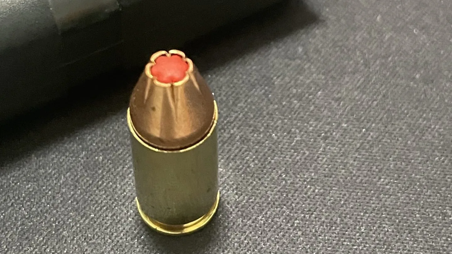 Hornady Critical Defense 9mm JHP ammo round standing up next to loaded Glock 45 Gen 5 mag