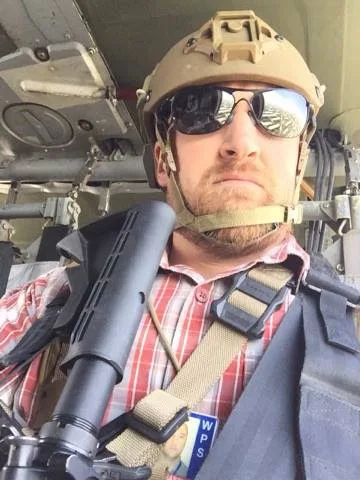 Jason Durham in helicopter in Afghanistan
